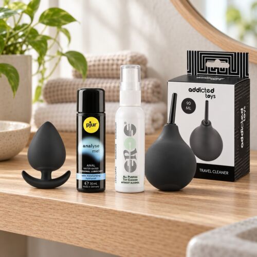 Kit anale per principianti con plug piccolo in silicone – scena d'atmosfera (immagine generata con IA)